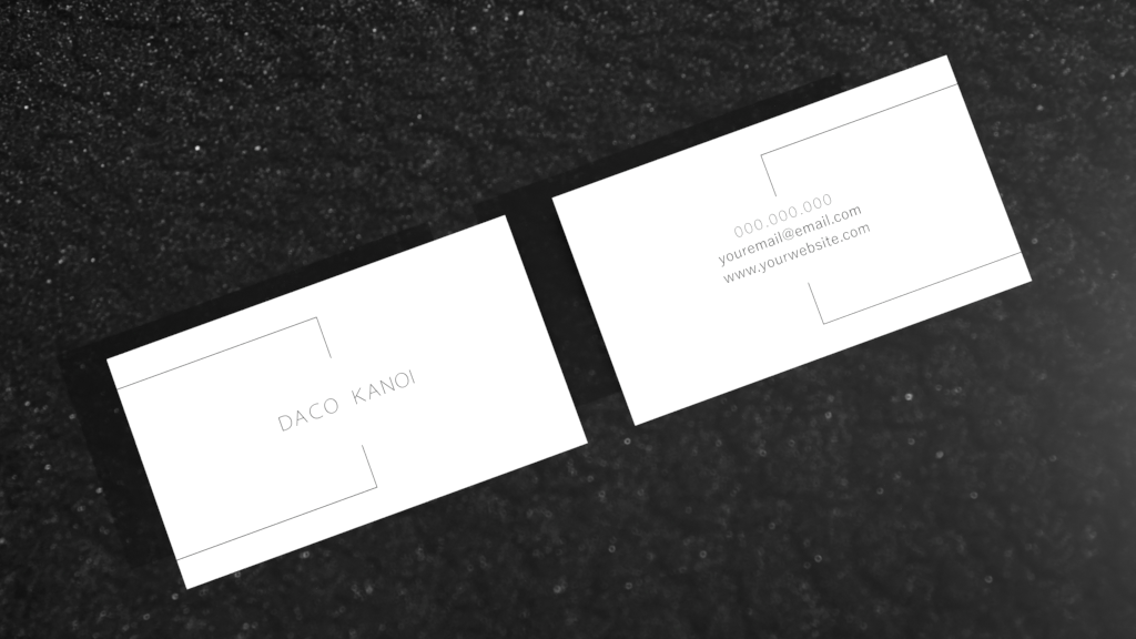 Mock photo shoot in Adobe Dimensions of a business card inspired by Japanese CEO's cards, with simple black elements on white background.