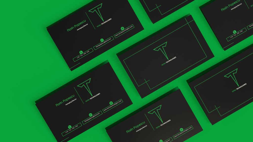 Picture from a photoshoot displaying both sides of a business card for a fictious company Tetra Technologies, with green elements on black background. The background of the photoshoot is green, making the branding elements and the card of the company to stand out.
